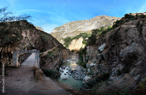 The bridge across the river at the bottom of Colca Canyon in the late afternoon, southern Peru