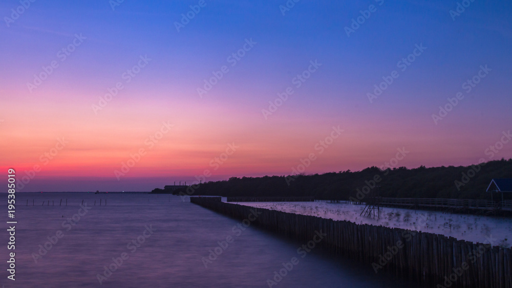 Longexposure romantic landscape sunset over the sea. Bangpoo Samutprakran Thailand.