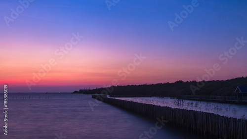 Longexposure romantic landscape sunset over the sea. Bangpoo Samutprakran Thailand.