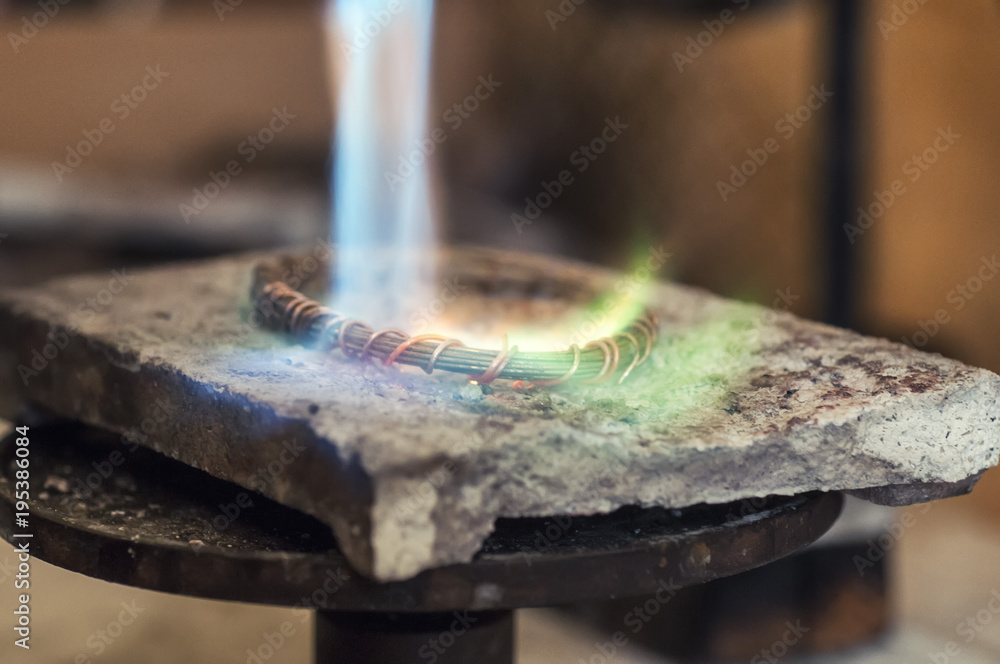 Craft jewelery making with flame torch Craft jewelery making with flame torch