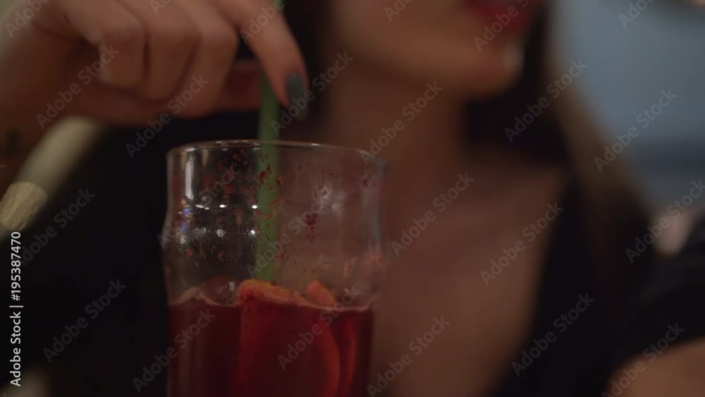 Drinking juice through a straw Drinking juice through a straw
