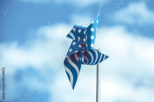 Blue pinwheel on sky