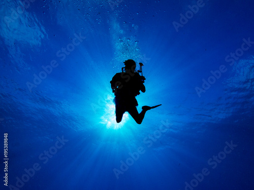 Silhouetted Diver with Sunball