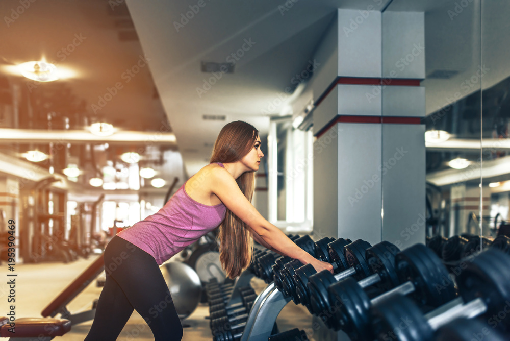 Long hair pretty girl training in the gym Long hair pretty girl training in the gym