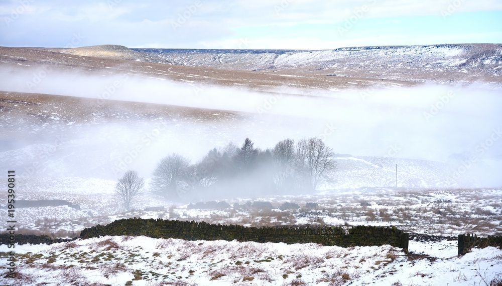 Snow on the hills and mist in the valleys of the English Pennines. Snow on the hills and mist in the valleys of the English Pennines.