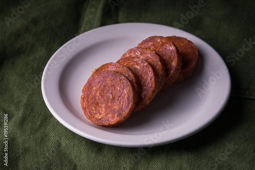 Sliced pepperoni on a snack plate