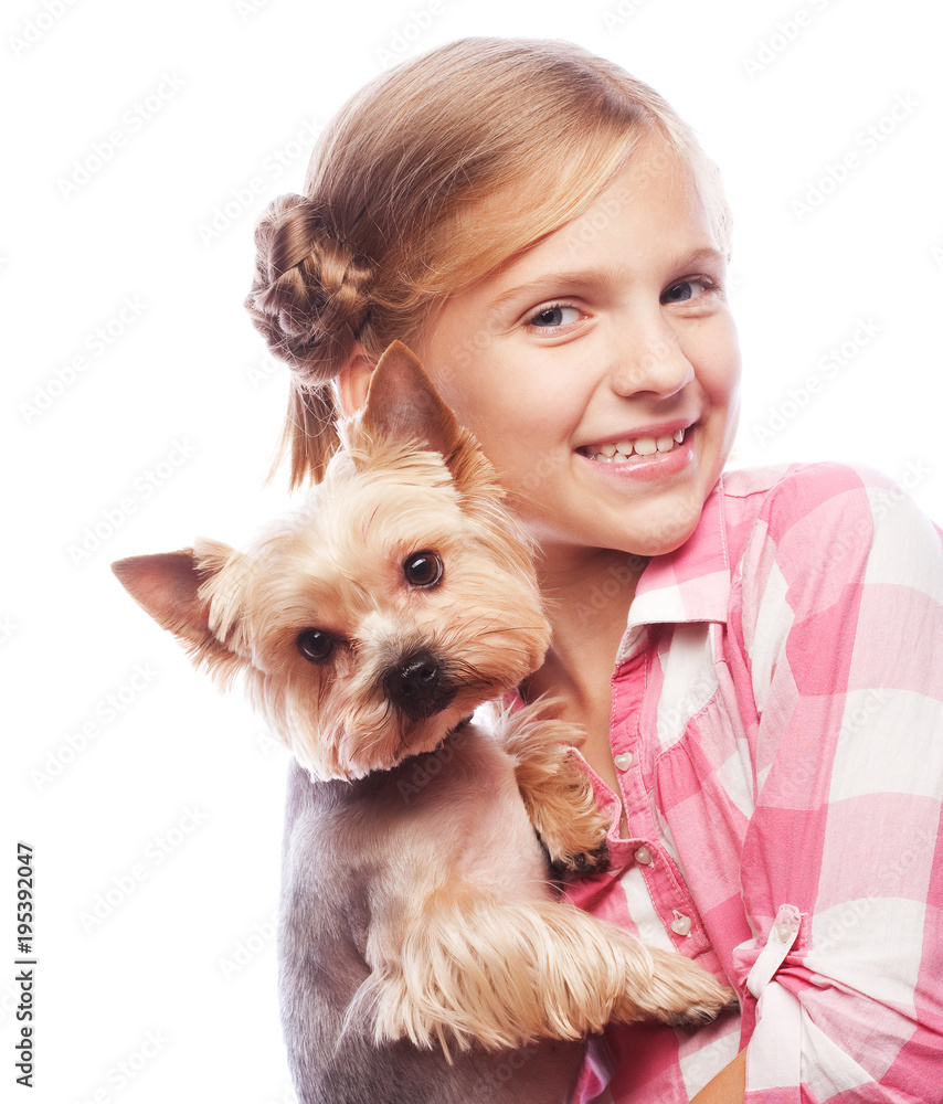 Happy girl holding her lovely yorkshire terrier dog. Isolated on