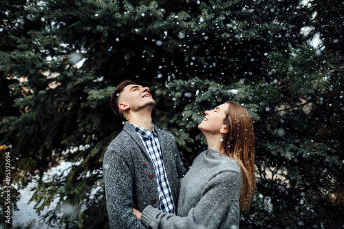 Couple spend time with each other, stand on the street and kiss