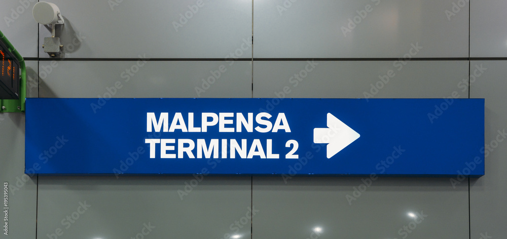 Sign pointing towards Malpensa Terminal 2, which services national as well as EasyJet flights throughout Europe. Sign pointing towards Malpensa Terminal 2, which services national as well as EasyJet flights throughout Europe.