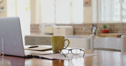 Wallpaper Mural Laptop with documents, spectacle and coffee mug on a table  Torontodigital.ca