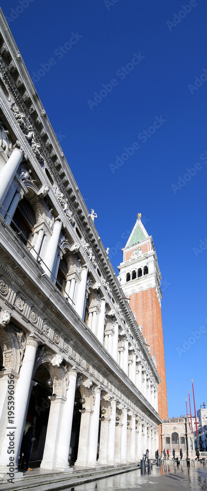 Venice Italy Saint Mark square and ancient Palace of National Library called Biblioteca Marciana with tide