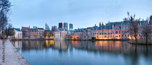 City Landscape, sunset panorama - view on pond Hofvijver and complex of buildings Binnenhof in from the city centre of The Hague, The Netherlands photo