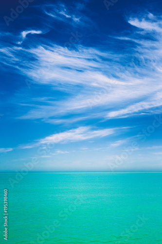 Sky Over Calm Water Of Sea Or Ocean. Natural Background With Gently Blue Colors.