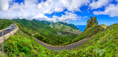 Anaga Mountains, Tenerife, Canary islands, Spain: Taganana and serpantine road in green mountains with horizon landscape near shore of Atlantic ocean