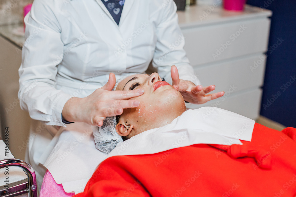Cosmetology. Woman is having face mask in cosmetology cabinet. Beauty concept Cosmetology. Woman is having face mask in cosmetology cabinet. Beauty concept