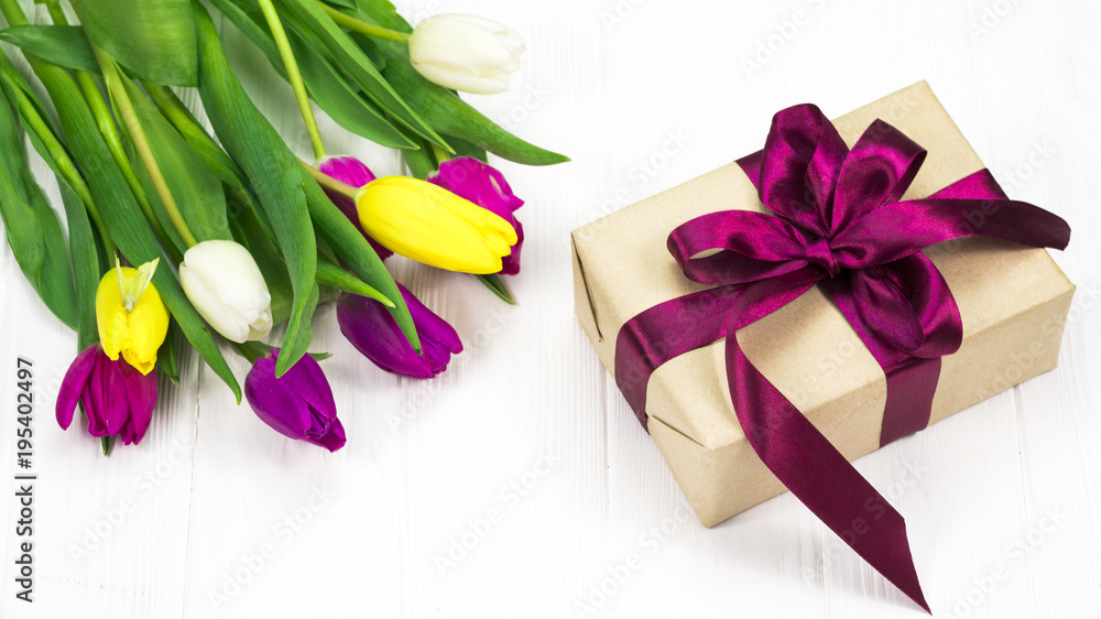 .tulips and gift on a white background