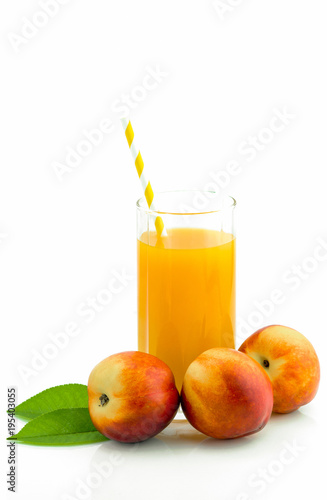 Peaches and juice on a white background