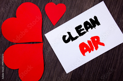 Writing text showing  Clean Air. Concept meaning Global Environmental Health For Industry Pollution written on notobook paper note on the wooden background with Love Heart. photo