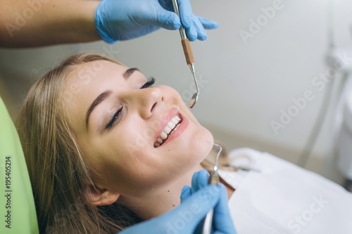 Beautiful girl at a dentist s review in a dental clinic.
