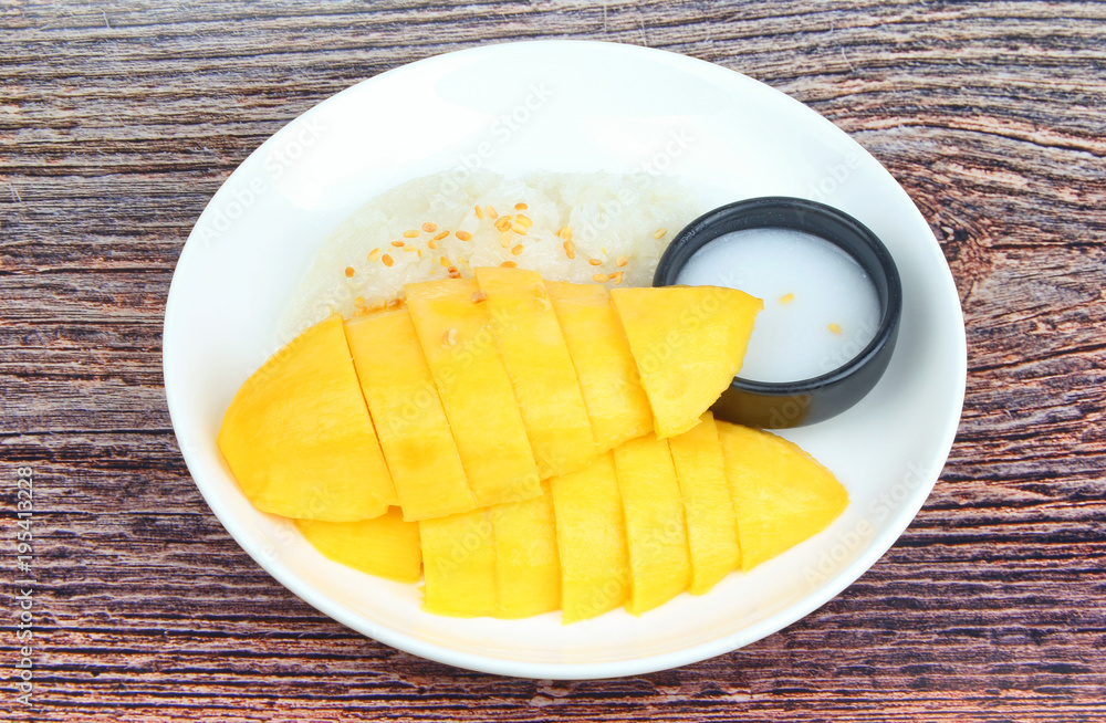 Ripe golden mango with green and white of sticky rice. Ripe golden mango with green and white of sticky rice.