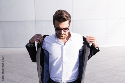 Slika na platnu Male businessman or worker in black suit