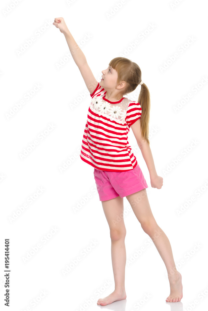 A little girl does gymnastic exercises. A little girl does gymnastic exercises.
