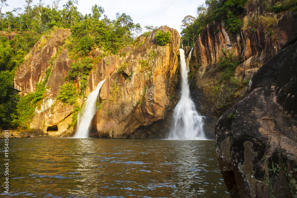 Fototapeta premium Waterfall and stone beautiful with sunshine