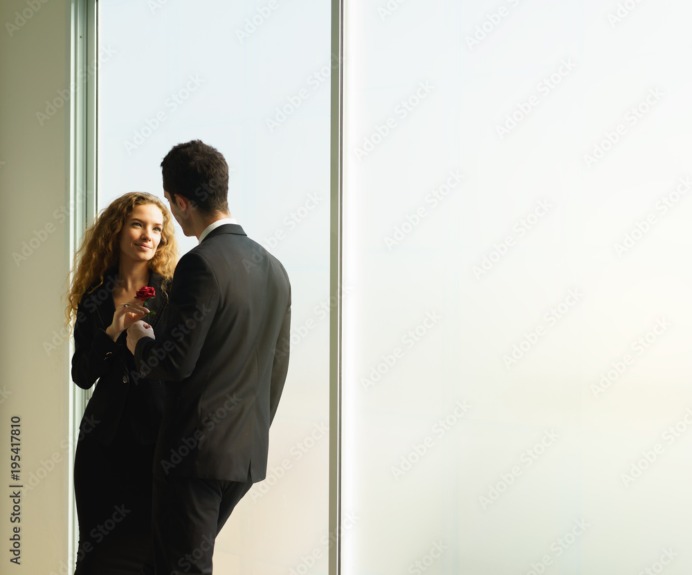 Man and woman fell in love with work.businessman and businesswoman felling love in office Man and woman fell in love with work.businessman and businesswoman felling love in office