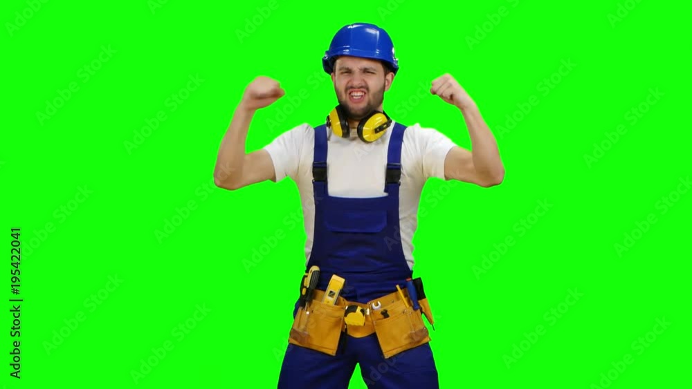 Builder is pleased with the finished object. Green screen Builder is pleased with the finished object. Green screen