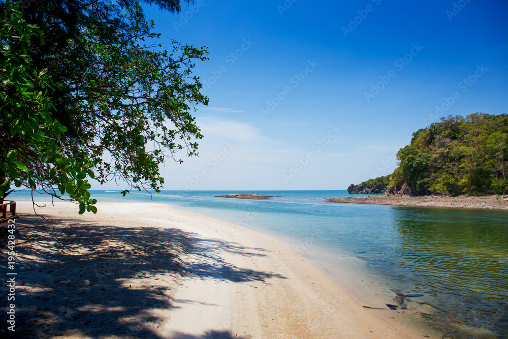 Summer beach with clearly sea and blue sky at Tarutao national park Satun, Thailand. Using for summer background 