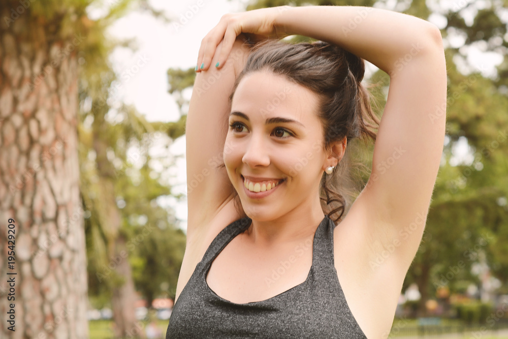 Portrair of young beautiful woman doing exercise at park Portrair of young beautiful woman doing exercise at park