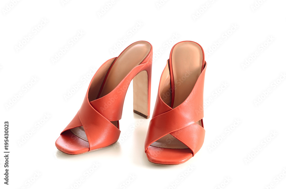 Open toe criss cross leather mule shoes isolated on white background. Fashion heels shoes, terracotta color.. Open toe criss cross leather mule shoes isolated on white background. Fashion heels shoes, terracotta color..