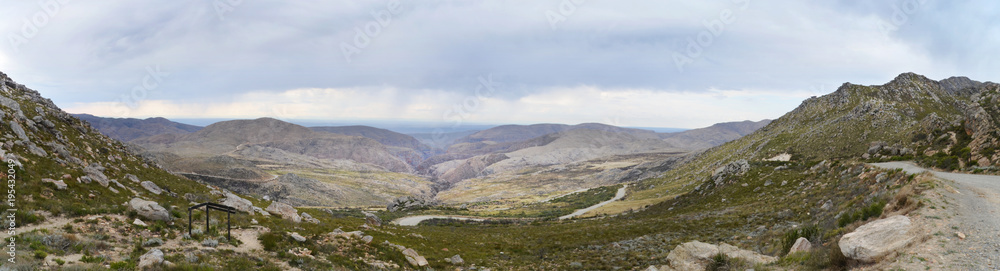 The view from the summit of the 27 km Swartberg Pass, connecting Oudtshoorn to Prince Albert, South Africa. A spectacular mountain passes, it is a World Heritage site.