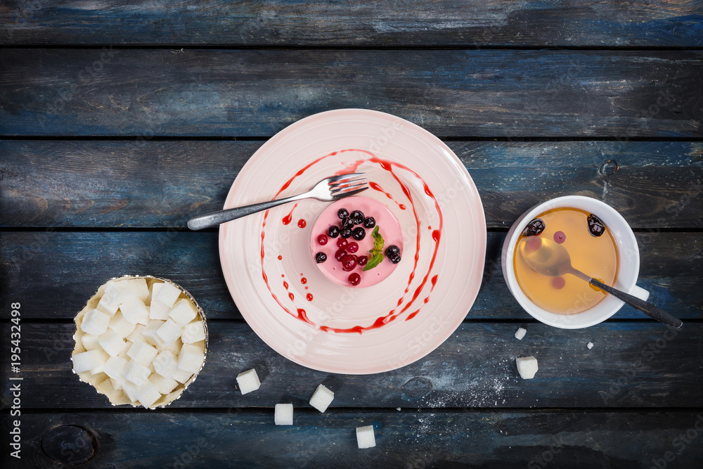 Caramel cheesecake with strawberry on the wooden background top view Caramel cheesecake with strawberry on the wooden background top view