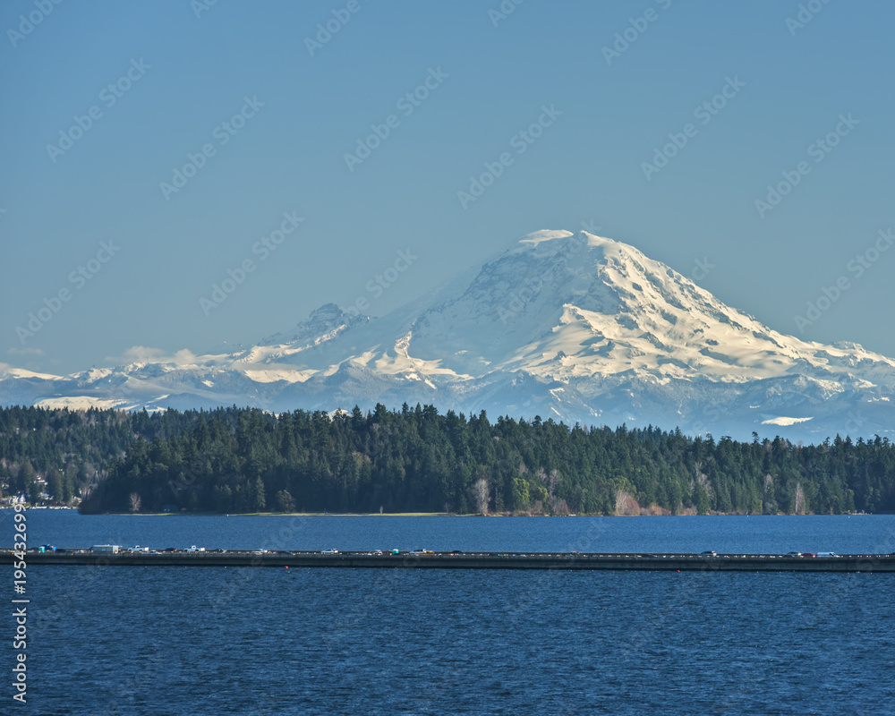 Interstate 90 Floating Bridge cuts across Lake Washington near Seattle on a Perfectly Blue Day with Mount Rainier in the Distance