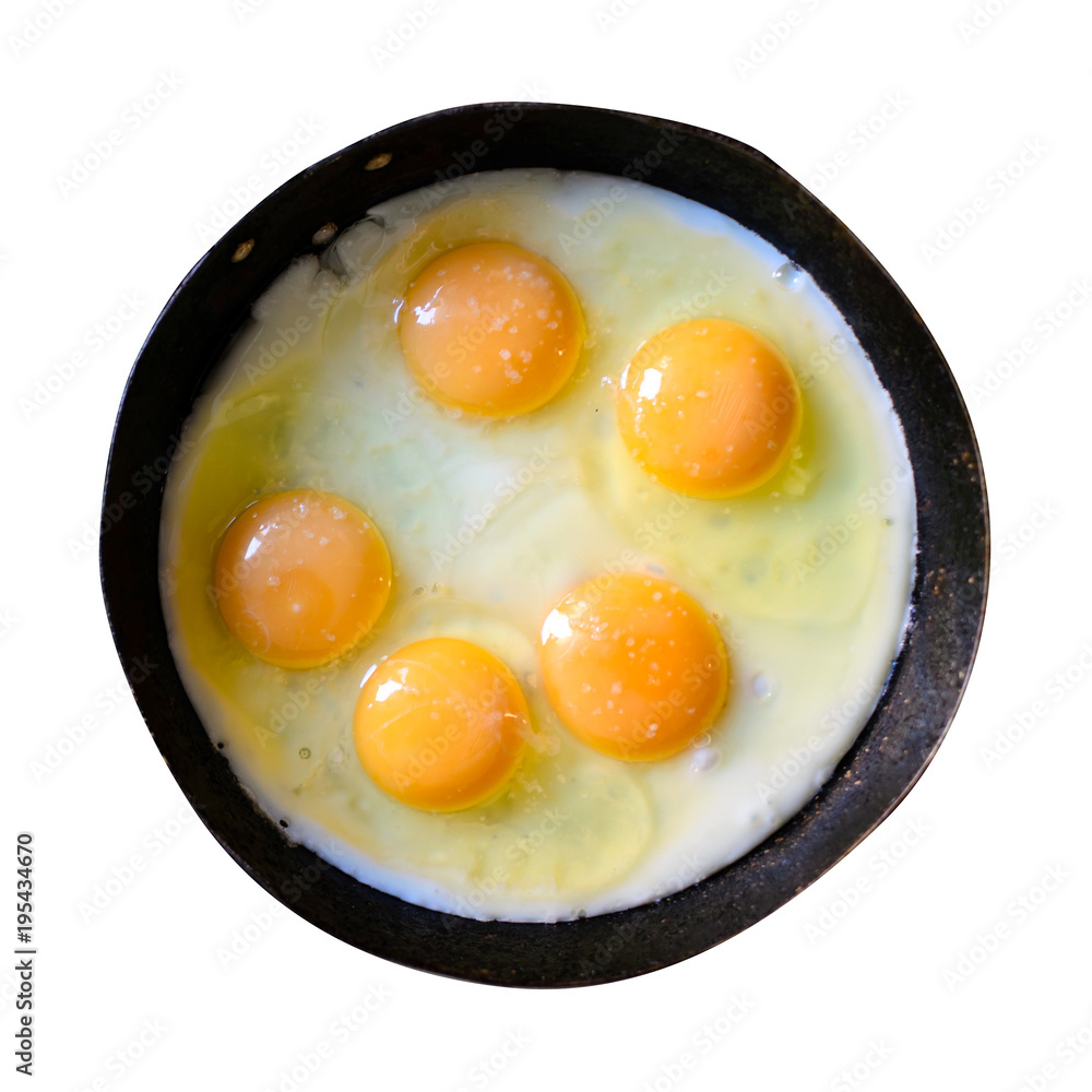Appetizing fried several eggs in a cast-iron frying pan isolated on white Appetizing fried several eggs in a cast-iron frying pan isolated on white