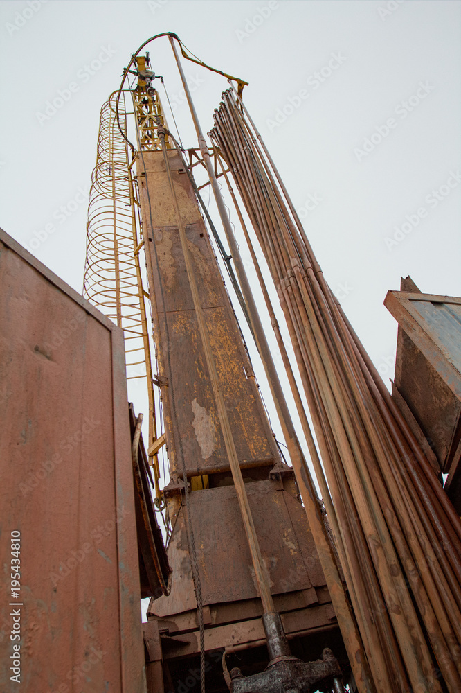 Construction site with hydraulic drilling machines and pipes