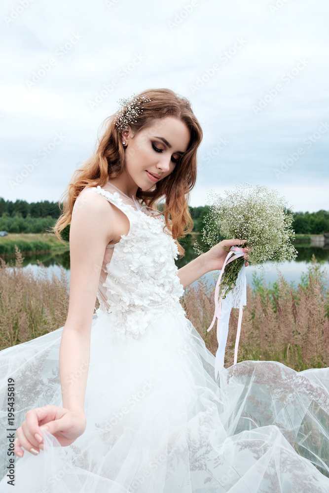 young pretty bride in white wedding dress outdoors, make up and hairstyle young pretty bride in white wedding dress outdoors, make up and hairstyle