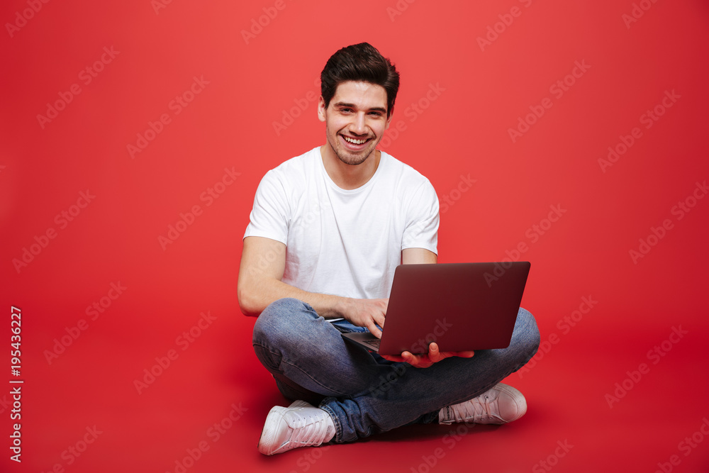 Portrait of a happy young man in white t-shirt Portrait of a happy young man in white t-shirt