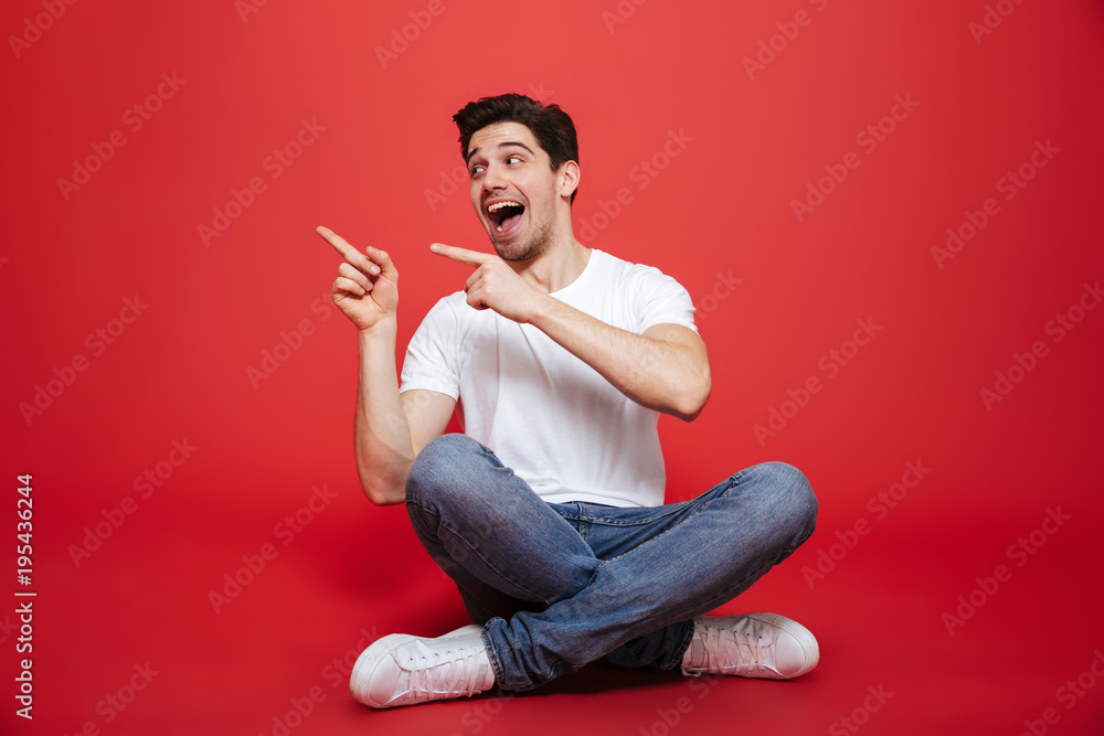 Portrait of an excited young man in white t-shirt Portrait of an excited young man in white t-shirt