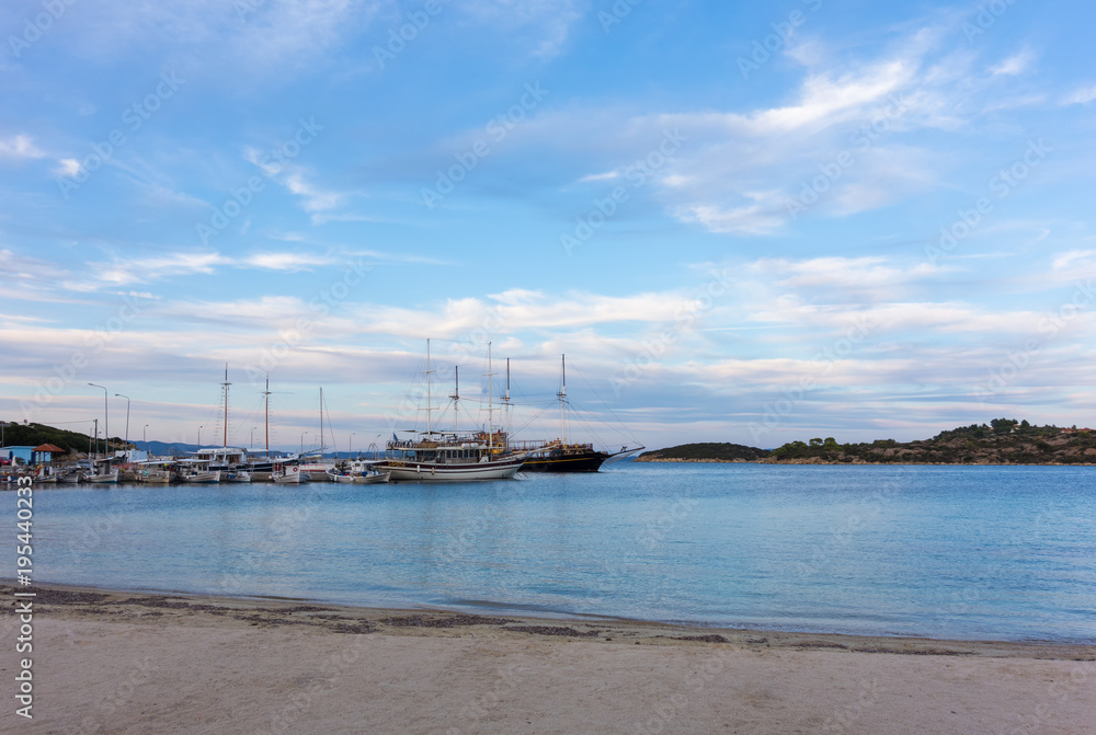 Gorgeous sea and sky colors in the dusk in the little Ormos Panagias gulf, Sithonia, Chalkidiki, Greece 