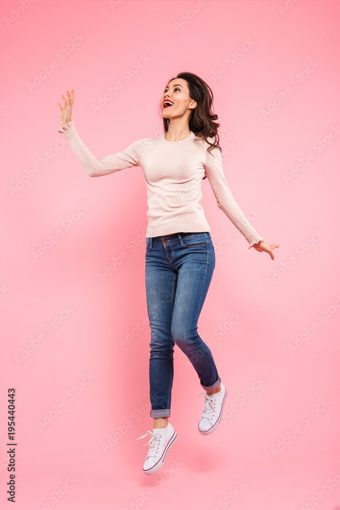 Full-length portrait of charming woman 20s wearing casual looking aside on copyspace with delight, isolated over pink background Full-length portrait of charming woman 20s wearing casual looking aside on copyspace with delight, isolated over pink background