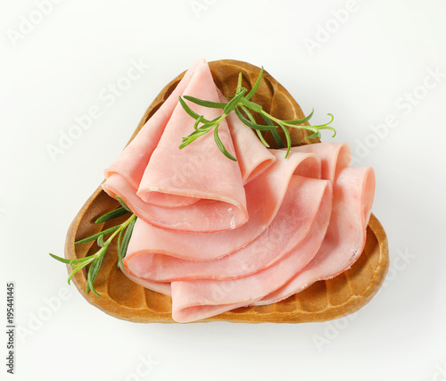 thin slices of ham with rosemary