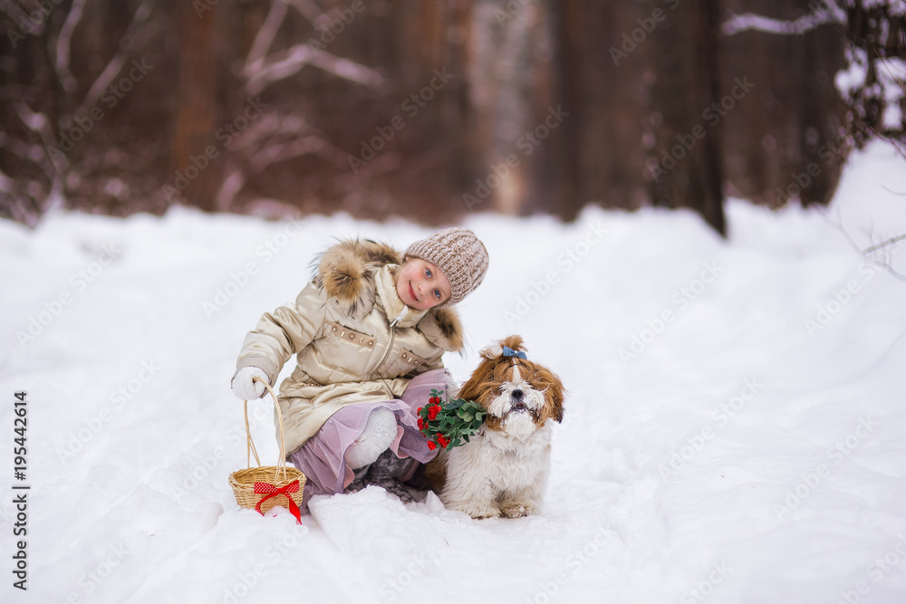 Sweet girl and a dog with flowers spring day in the forest for the holiday