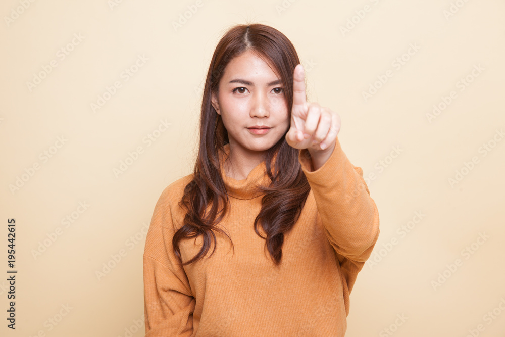 Fototapeta premium Asian woman touching the screen with finger.