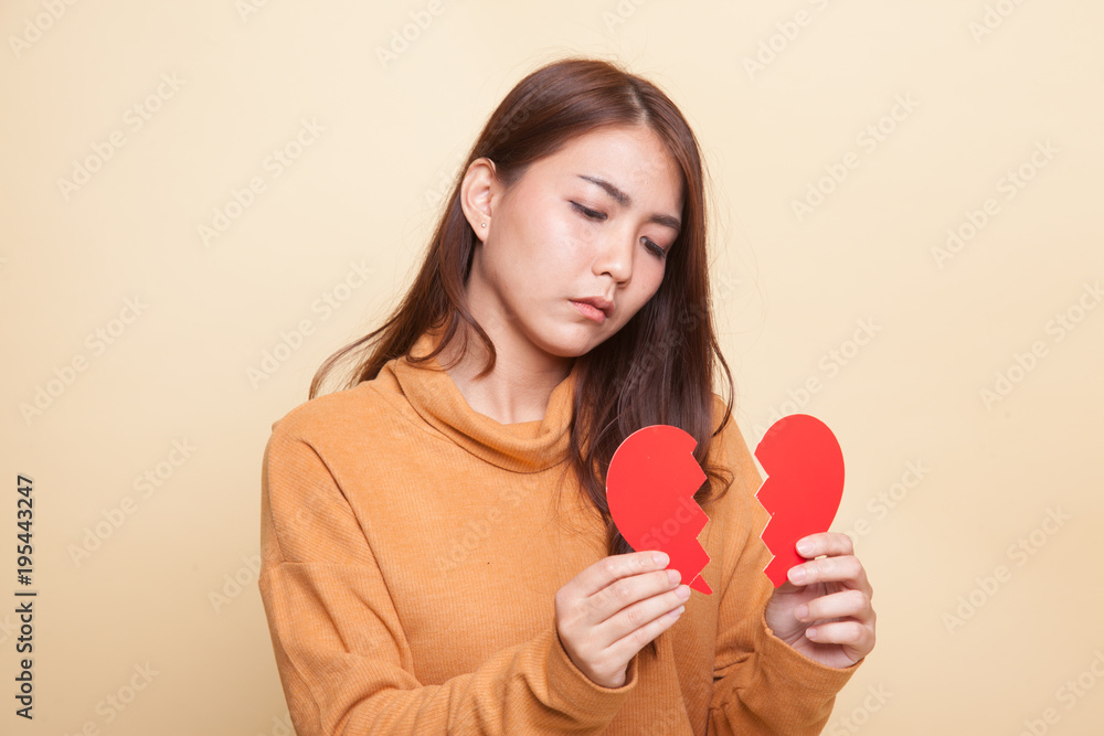 Beautiful young Asian woman with broken heart. Beautiful young Asian woman with broken heart.