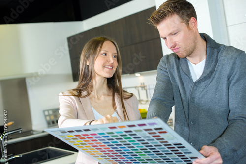 Couple considering color samples