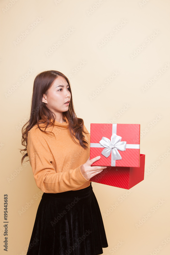Young Asian woman open a gift box. Young Asian woman open a gift box.