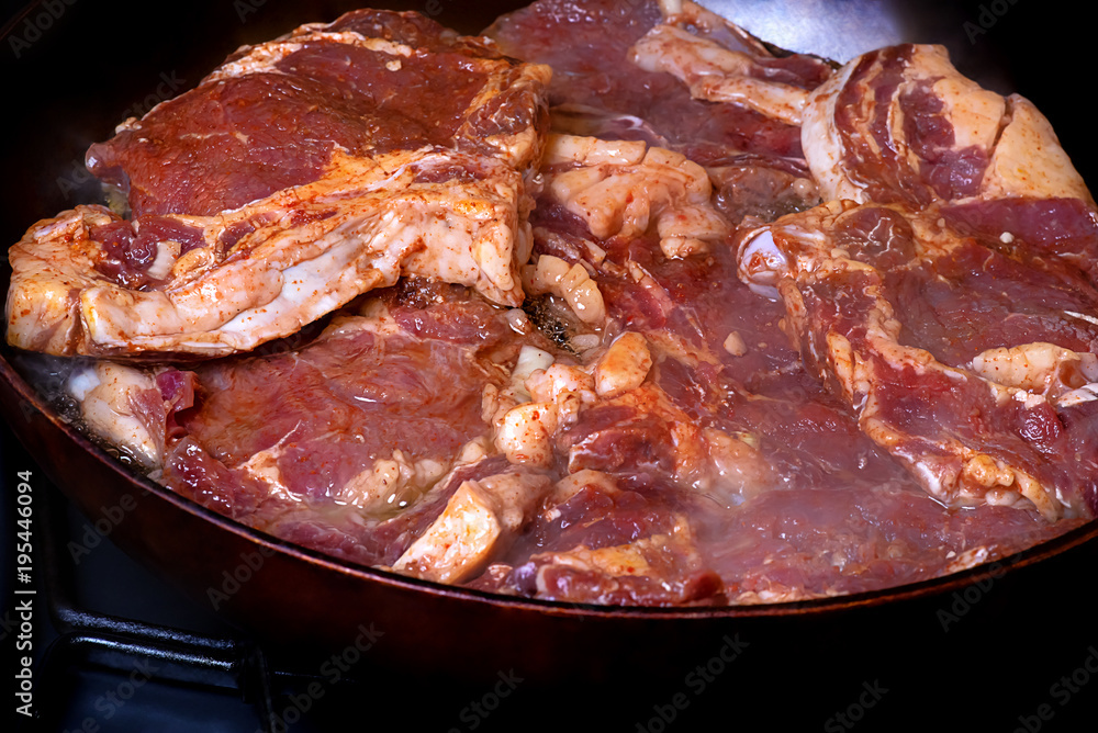 Meat entrecote fried on a frying pan Meat entrecote fried on a frying pan