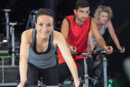 sporty group of people on spinning class